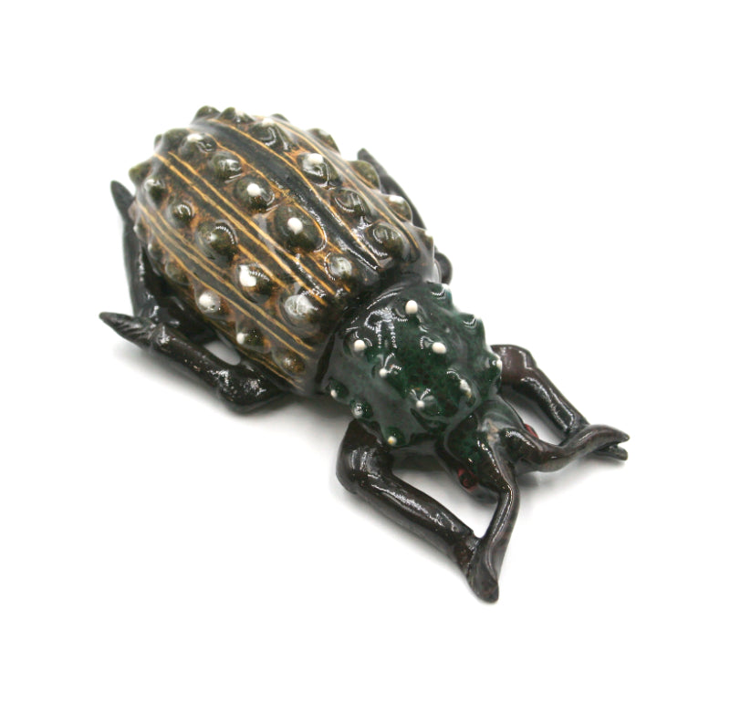 Emerald beetle with yellow markings