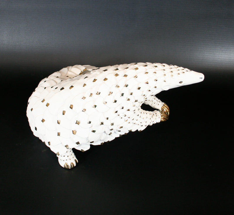 White & Gold Edition Pangolin standing on two hind limbs with curled tail
