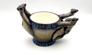 Upside down elephant ring bowl