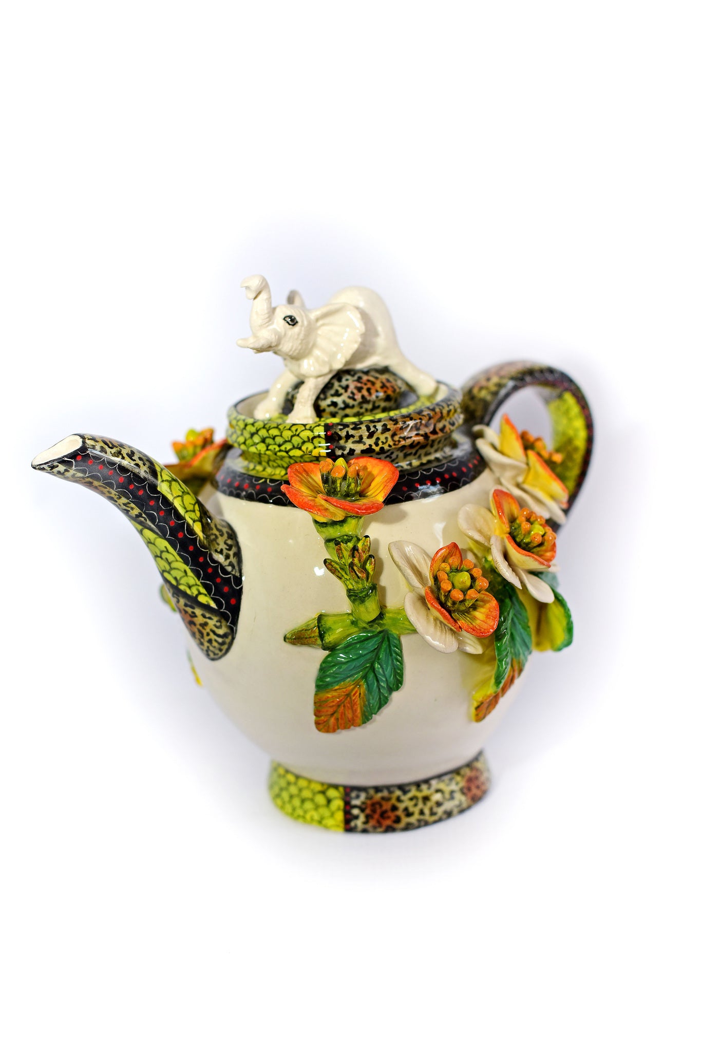Teapot with white elephant on lid