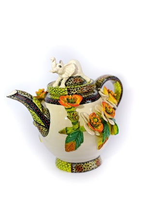 Teapot with white elephant on lid