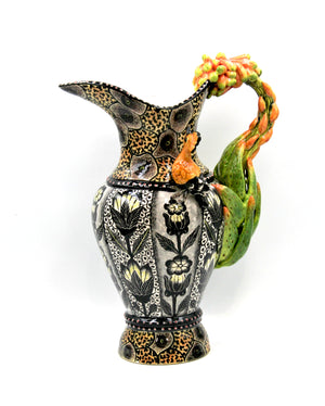 Yellow and black hoopoe and flower jug