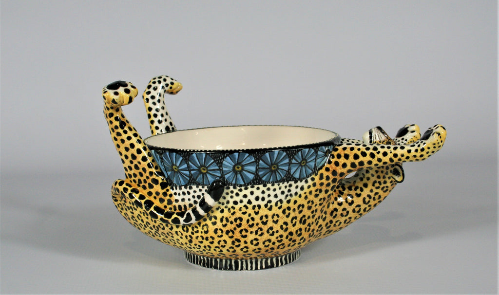 Upside dowl leopard bowl with patterned blue rim