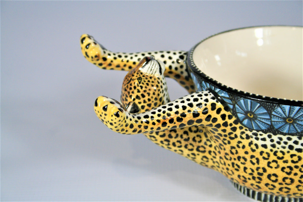 Upside dowl leopard bowl with patterned blue rim