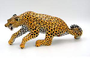 Stalking leopard with open mouth