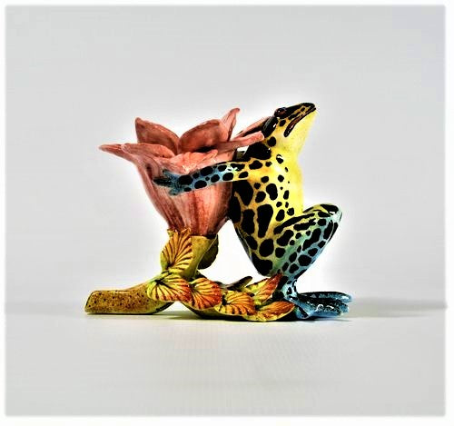 Blue & green leopard frog with open pink petal candlestick