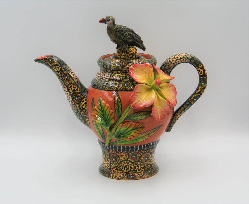 Terracotta teapot with vulture and flowers