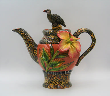 Terracotta teapot with vulture and flowers