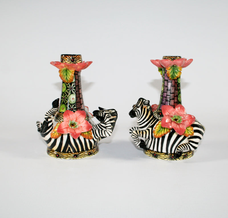 Tall Zebra Candlesticks with pink flowers