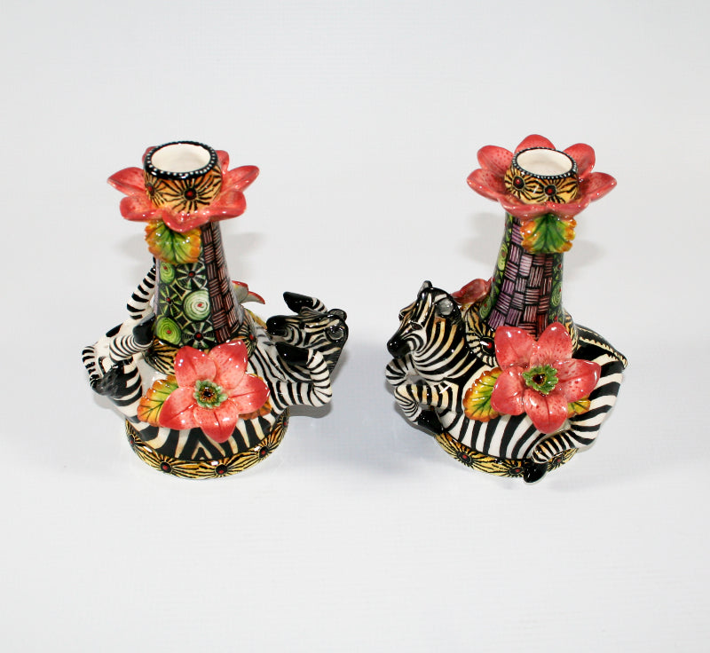 Tall Zebra Candlesticks with pink flowers