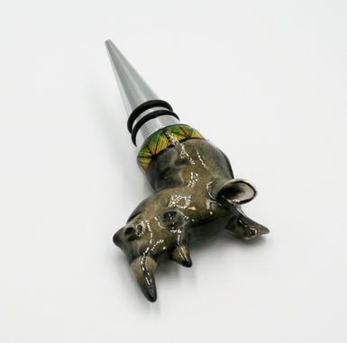 Rhino with green & yellow behind black stripes & red dots wine bottle stopper