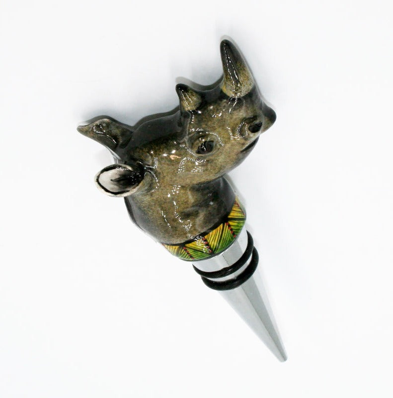 Rhino with green & yellow behind black stripes & red dots wine bottle stopper