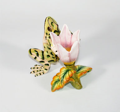 Light green frog with dark green markings and pink yellow flower candle holder