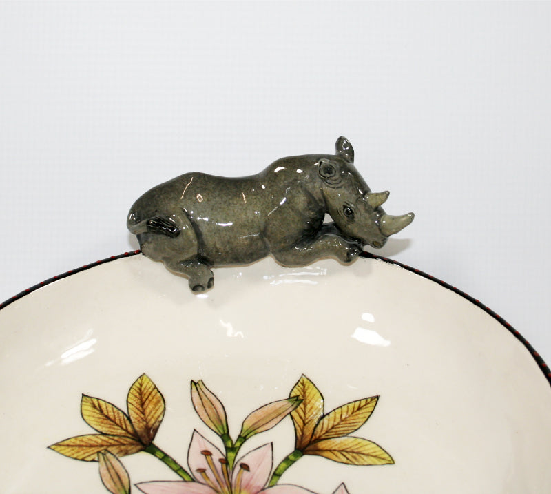 Large decorative bowl on legs with rhino