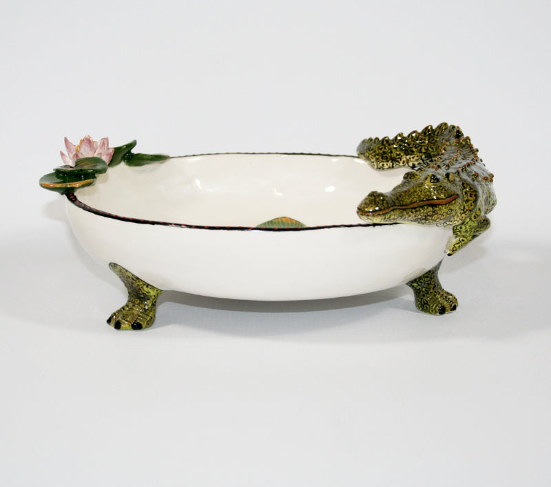 Large decorative bowl on legs with crocodile