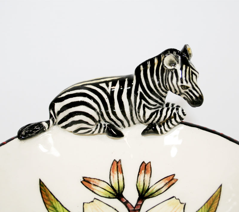 Small decorative bowl on legs with zebra