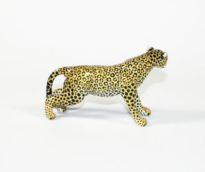 Medium Leopard stretched forward with head tilted left