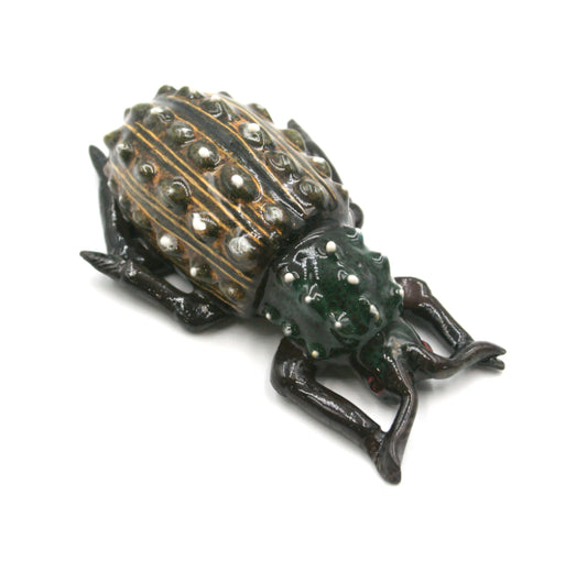 Emerald beetle with yellow markings