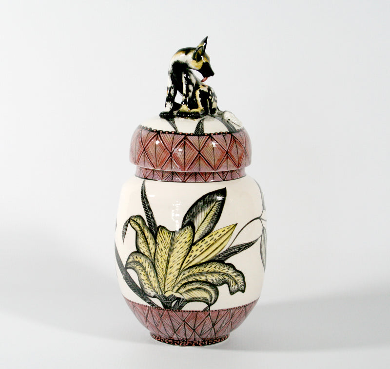 Wild dog on lid cookie jar