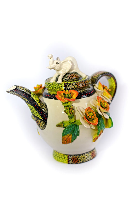 Teapot with white elephant on lid