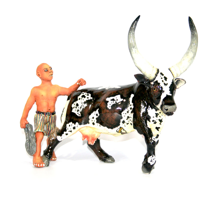 Ankole & shepherd with striped shorts and rope with calf