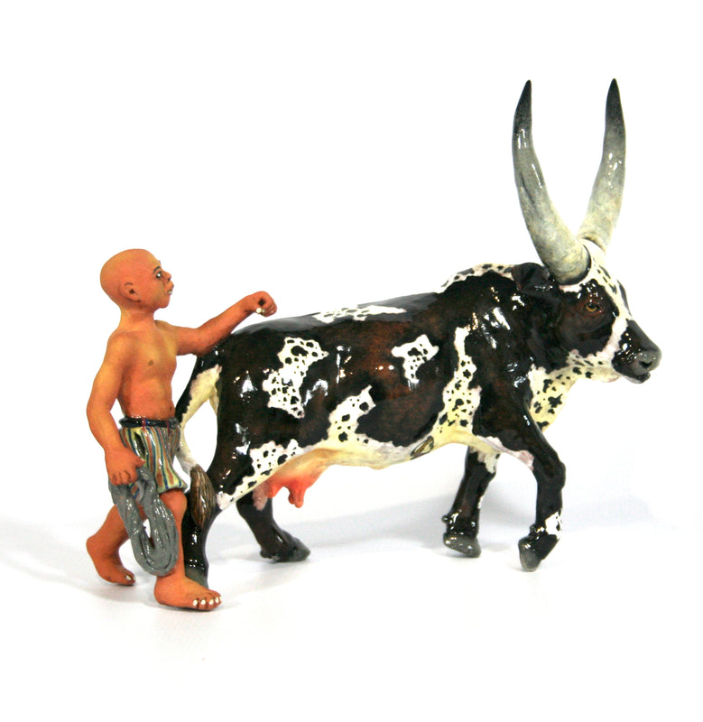 Ankole & shepherd with striped shorts and rope with calf