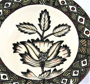 Wide Flat rim bowl with black , olive, red & white pattern