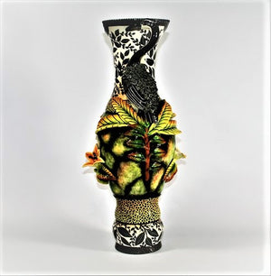 Heron handles large vase with black leaves