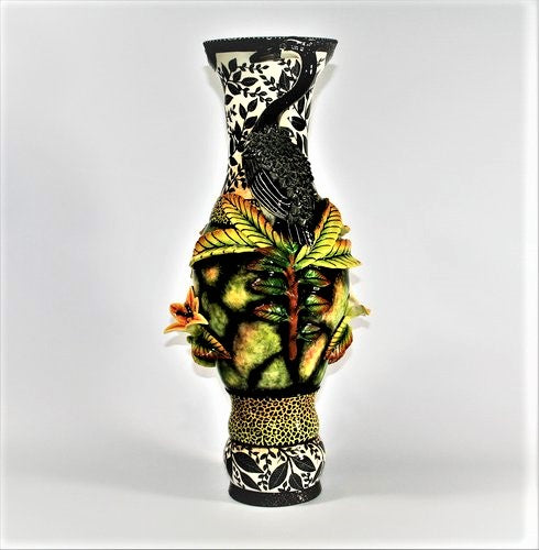 Heron handles large vase with black leaves