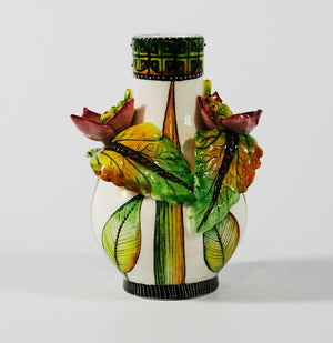 Small Vase with pink flowers with green stamens & green & yellow leaves