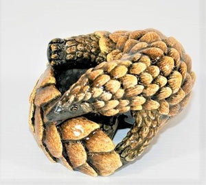 Small sitting curled pangolin