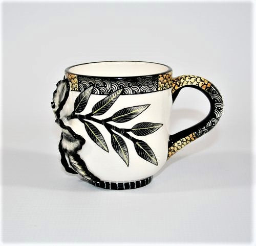 Curved line pattern handle with sculpted flower mug