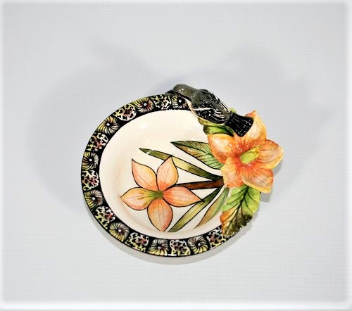 Small decorative bowl with white-throated robin & orange flower.