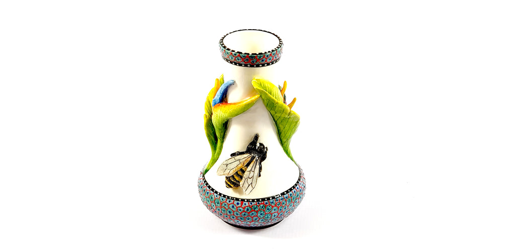 Bee and flower on white vase